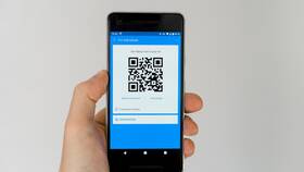 Как прочитать QR-код смартфоном в Лаура Марлин